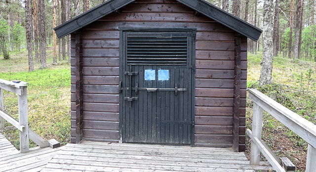Latrine near parking spot, Serri