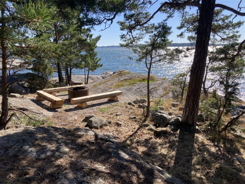 Fire pit, benches and a breathtakingly beautiful view of the water.