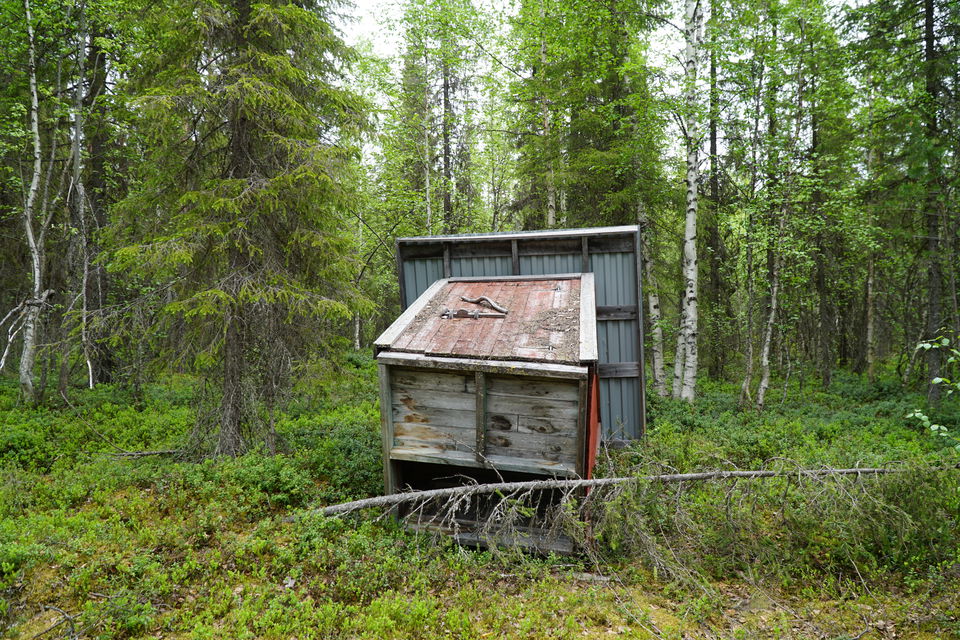 The outdoor toilet has fallen down