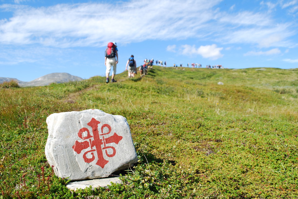 Pilgrim hikers on their way in the mountains
