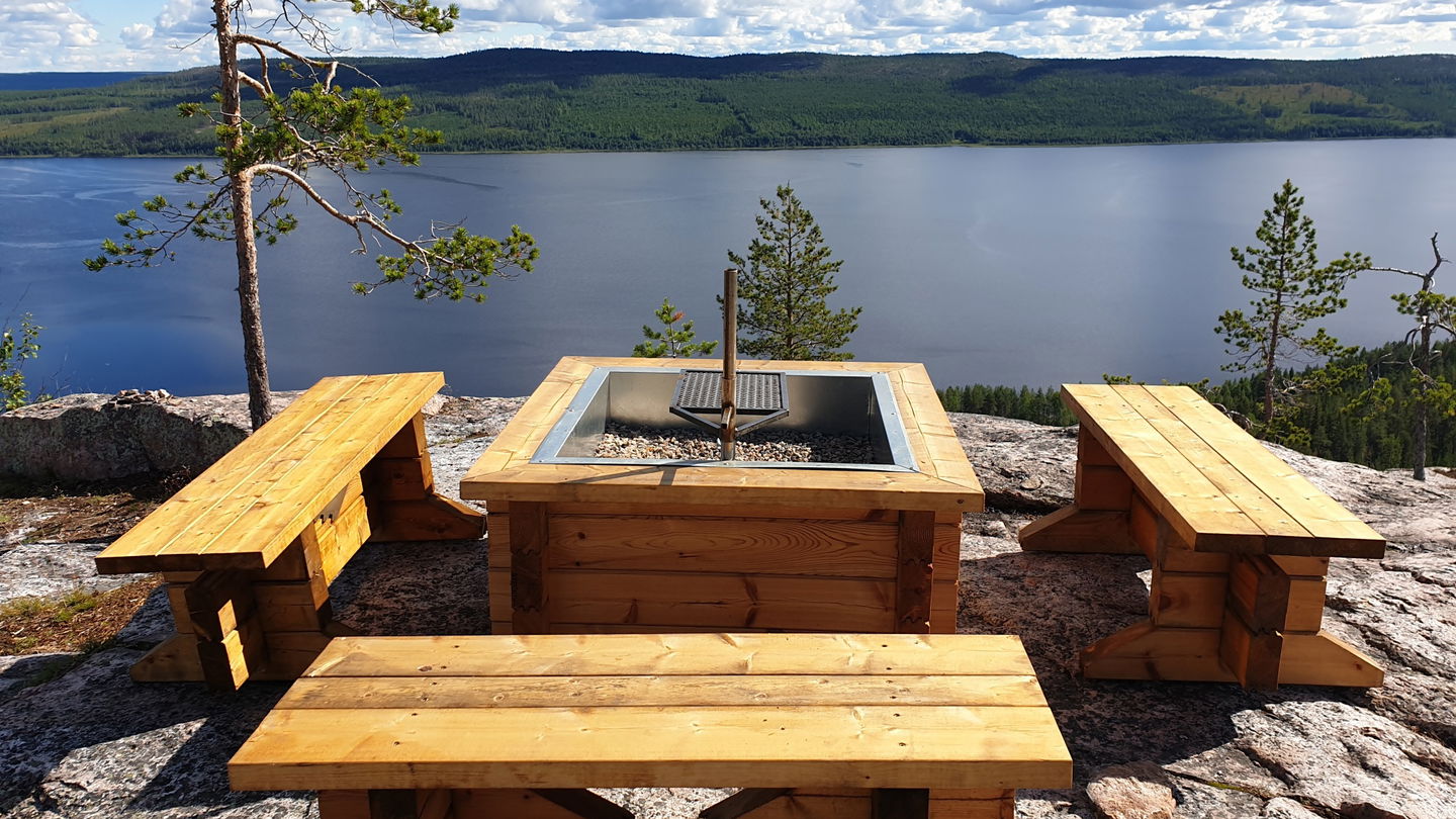 A fireplace with three benches.