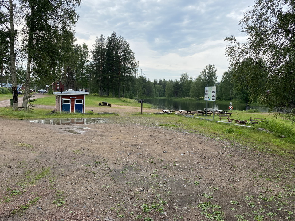 The parking lot is located near the swimming spot